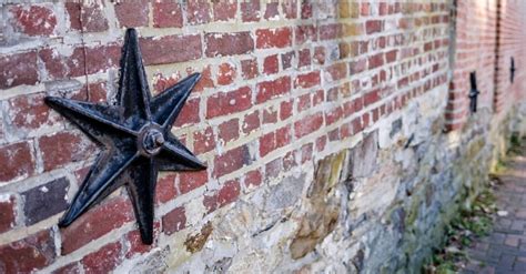 does a metal star on a house mean anything|cast iron stars on buildings.